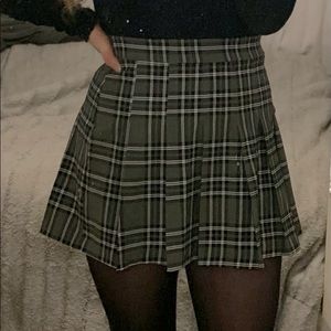 Green and black pleated plaid skirt